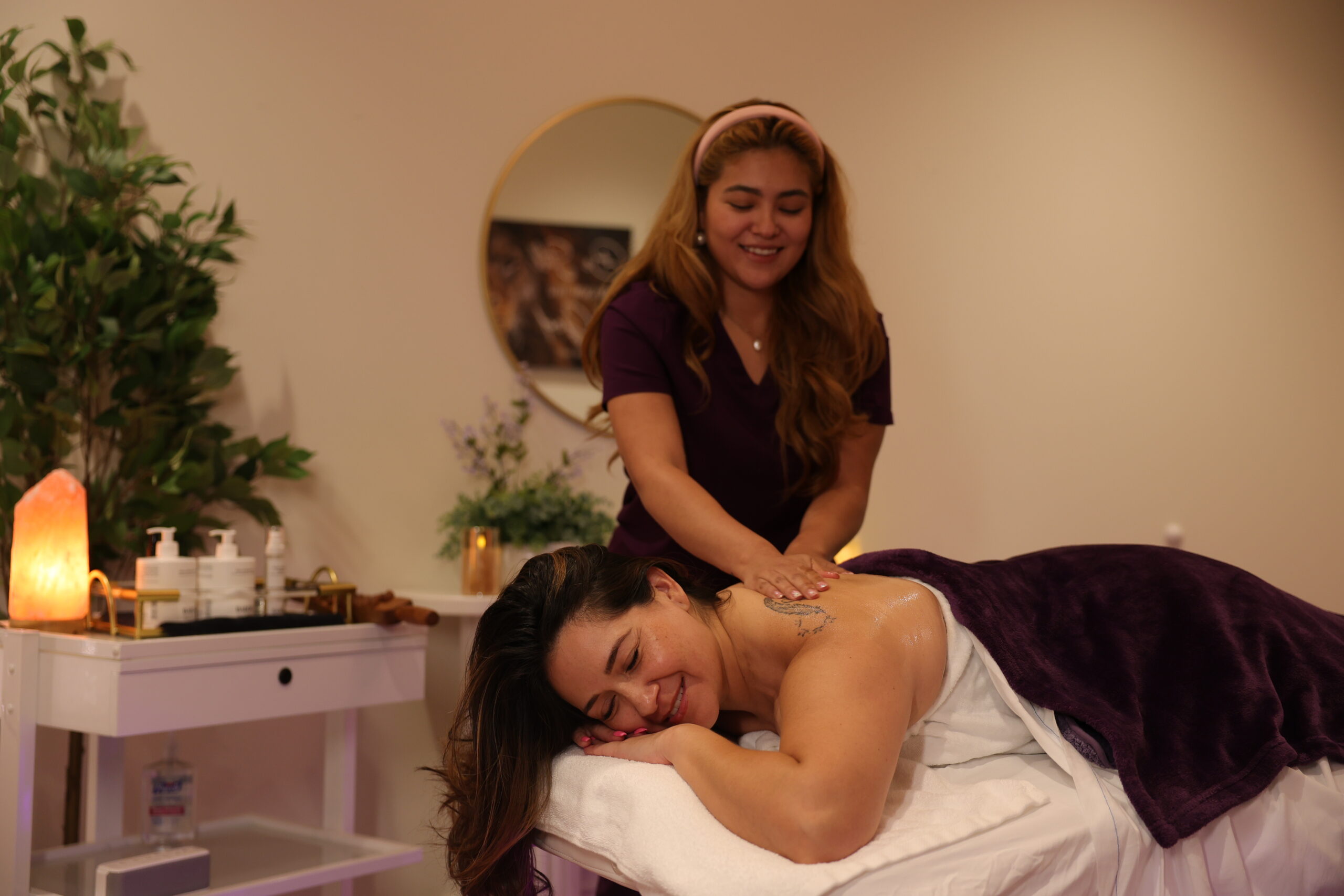Relaxing back massage at Nevaeh Med Spa with esthetician using essential oils