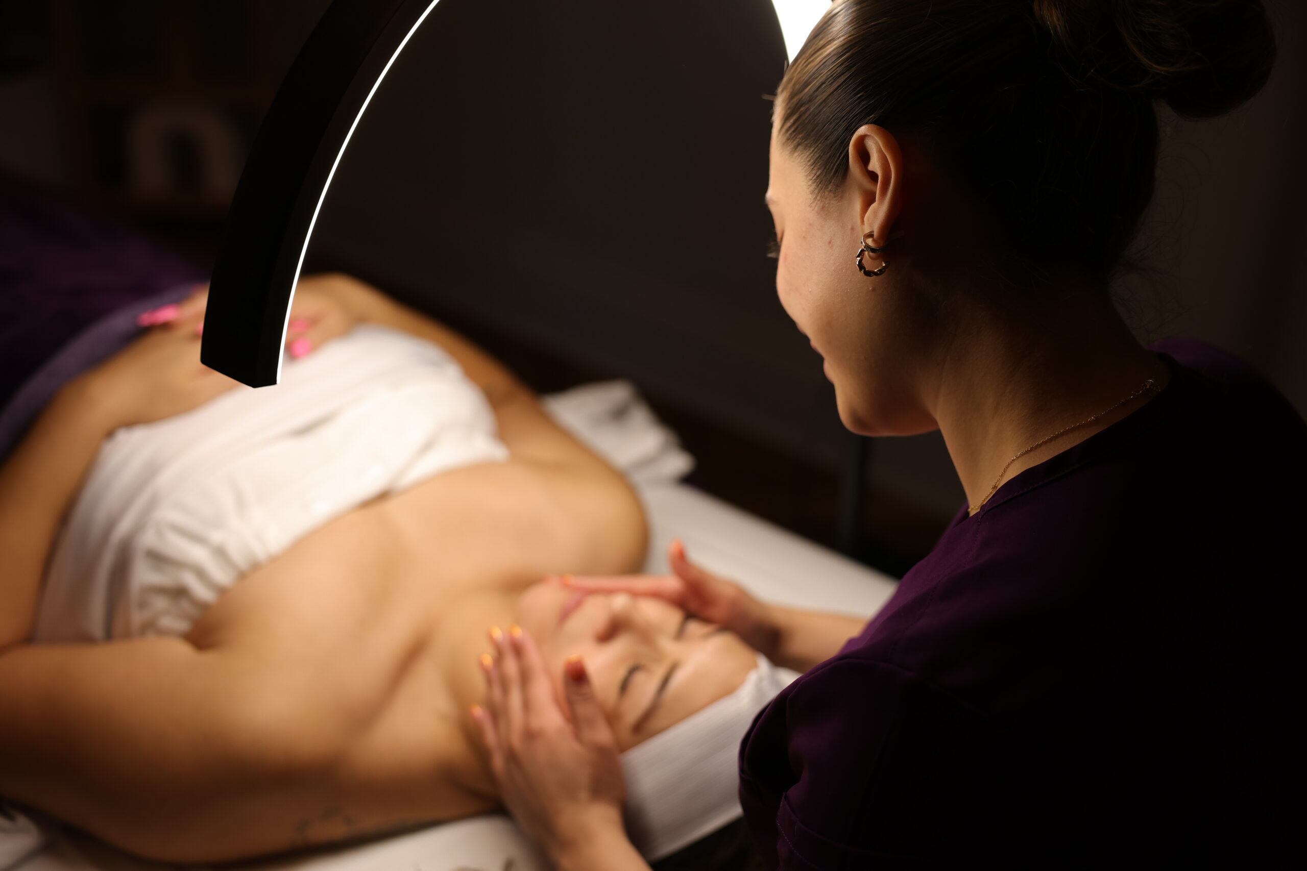 Client receiving relaxing HydraFacial / Facial therapy at Nevaeh Med Spa in San Antonio