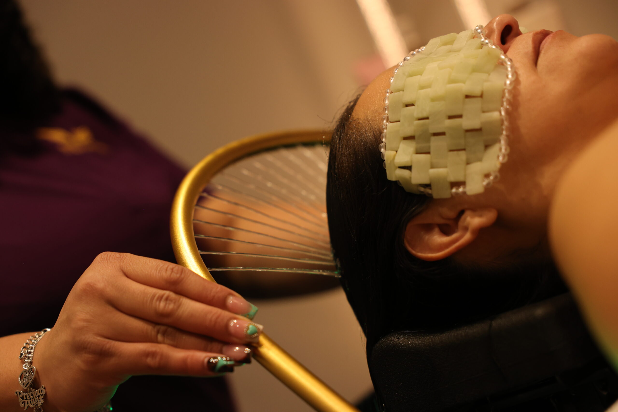 Woman receiving luxury head spa treatment at Nevaeh Med Spa San Antonio