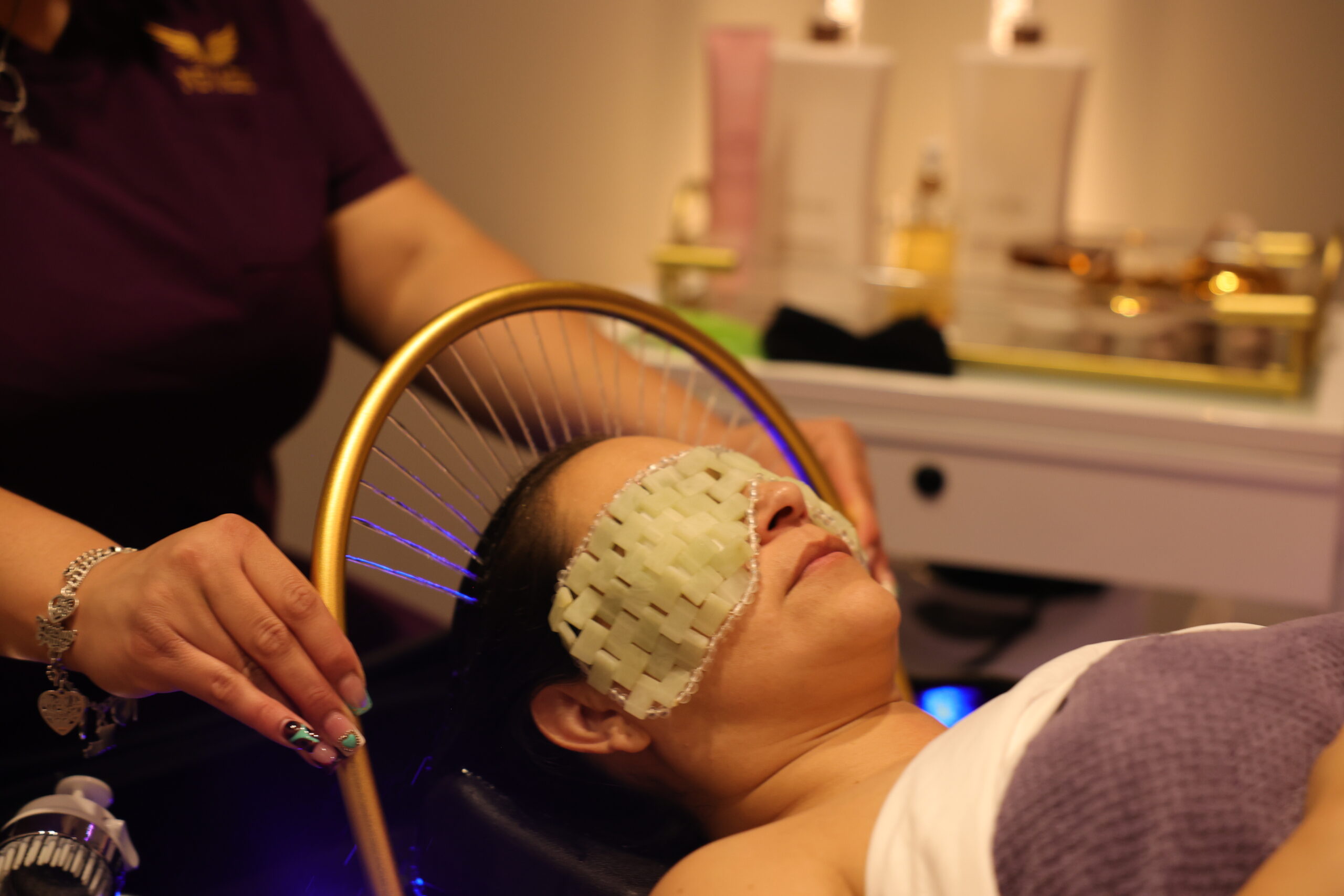 Scalp massage ring and jade eye mask used in head spa treatment at Nevaeh Med Spa.